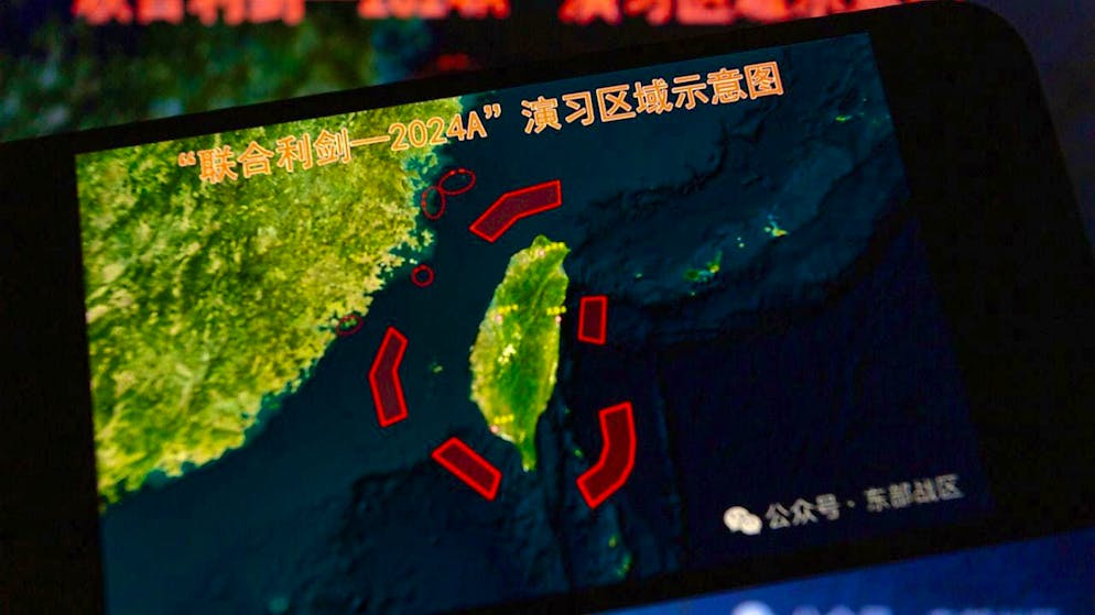 A map showing the locations of military exercises around Taiwan is displayed on a smartphone in May. As then, exercises are now taking place around the island republic.