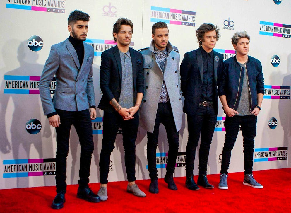 One Direction in November 2013 at the American Music Awards in Los Angeles: Zayn Malik, Louis Tomlinson, Liam Payne, Harry Styles, and Niall Horan (from left to right).