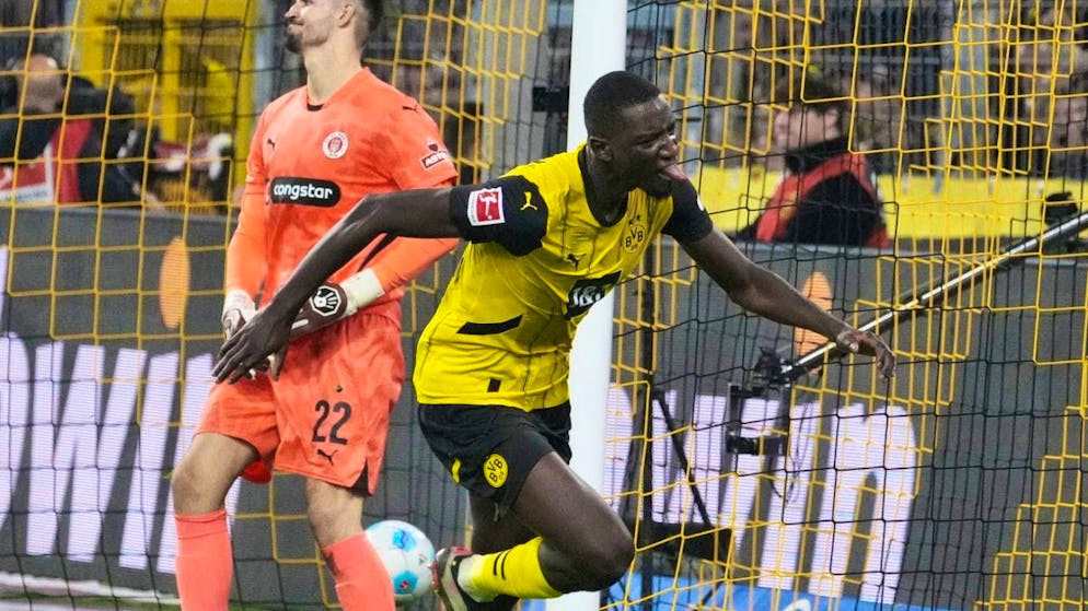 Dortmund's top scorer Serhou Guirassy celebrates his 2:1 winning goal
