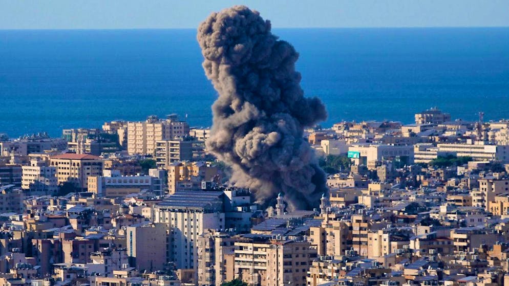Smoke rises after an Israeli airstrike. Photo: Hussein Malla/AP/dpa