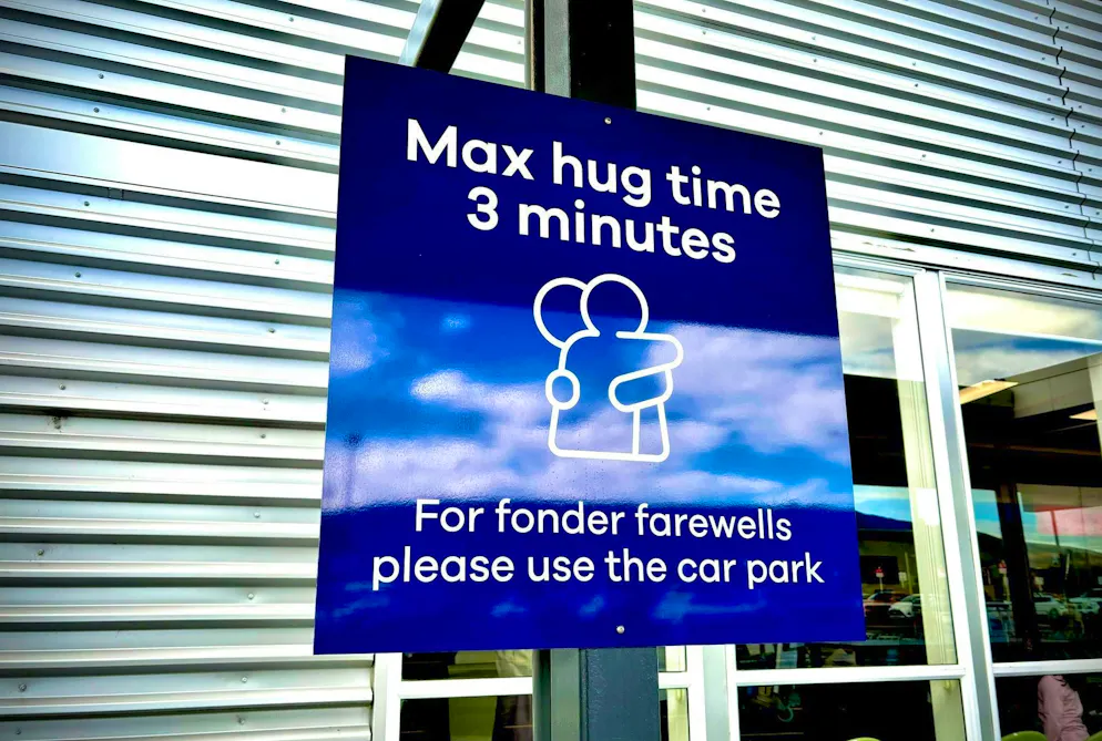 New Zealand: Three-minute cuddle limit at the airport goes viral - Gallery. The "cuddle sign" at Dunedin Airport in New Zealand has made headlines around the world.
