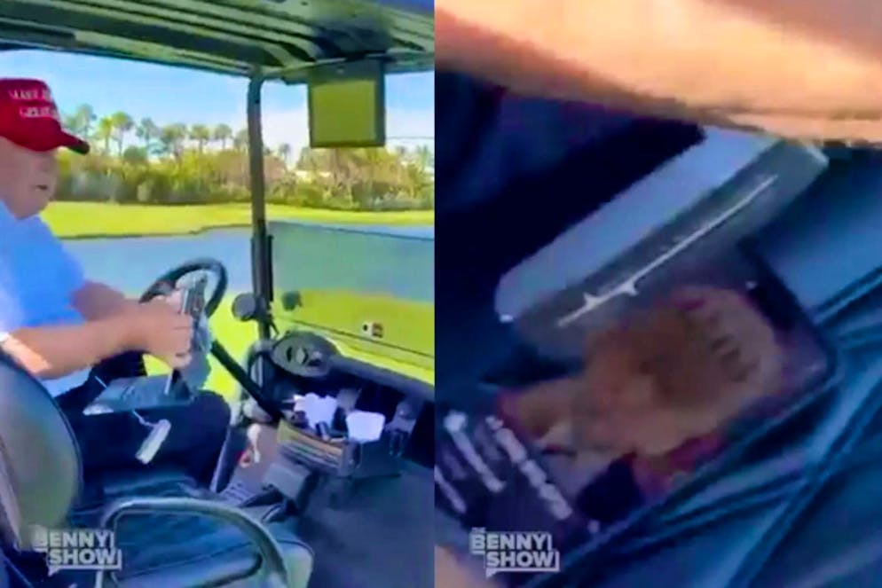 Donald Trump in his golf caddy in December 2023 - his lock screen can also be clearly seen here.