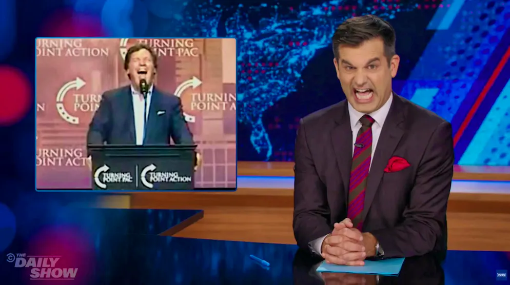 Michael Kosta, who hosts this week's "Daily Show" between Tuesday and Thursday, talks down to Tucker Carlson (left).