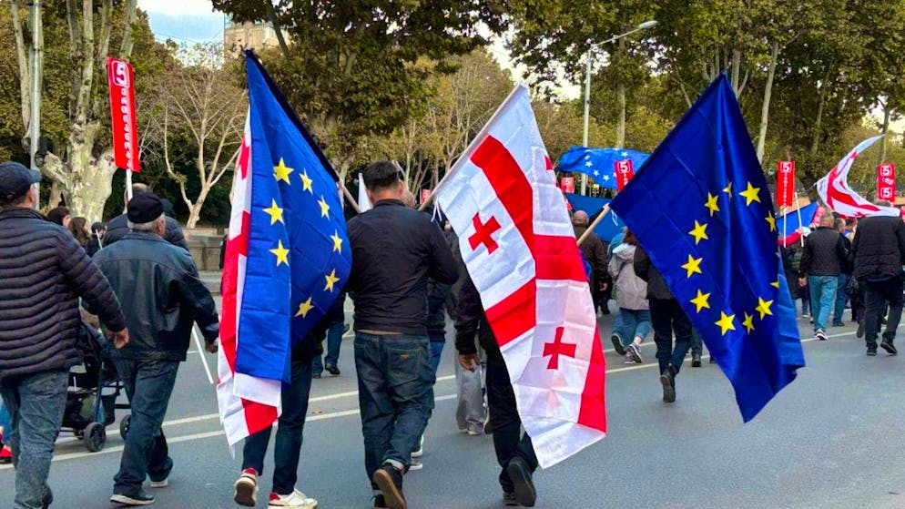 ARCHIVE - People come to a demonstration in the Georgian capital Tbilisi with Georgian and EU flags. Photo: Katharina Schröder/dpa