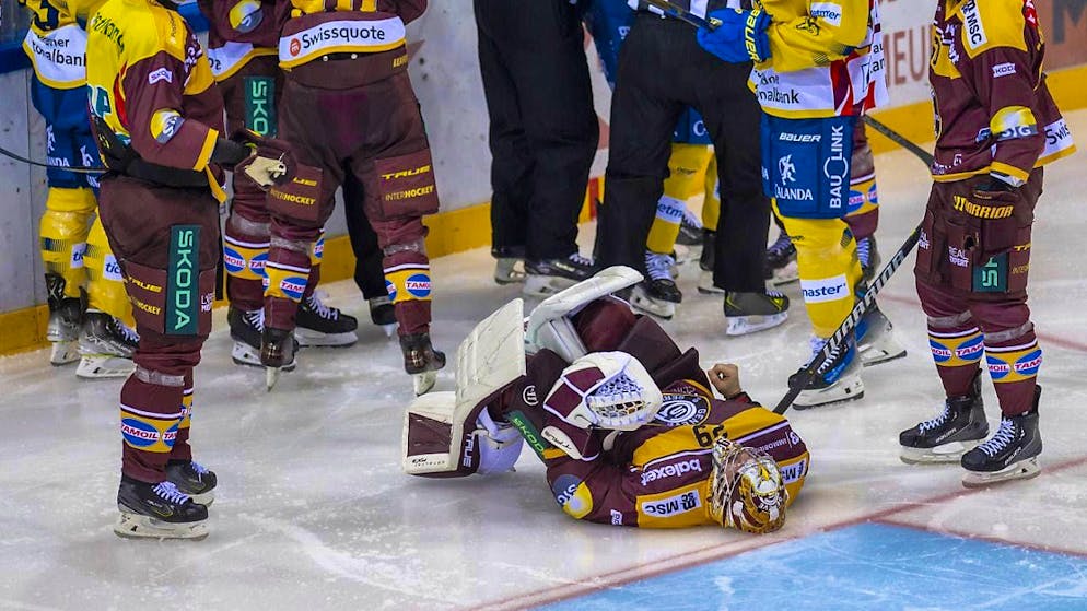 World champion Daniel Vozenilek on a high with EV Zug - Gallery. Servette goalie Robert Mayer has to be substituted injured after a collision