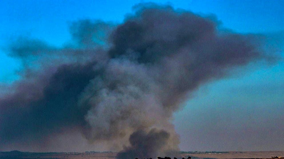 ARCHIVE - Heavy smoke rises over an Israeli village after it was attacked with rockets by Hezbollah fighters. Photo: STR/dpa