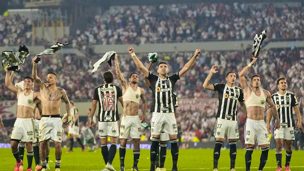 The Atletico Mineiro players celebrate reaching the final.