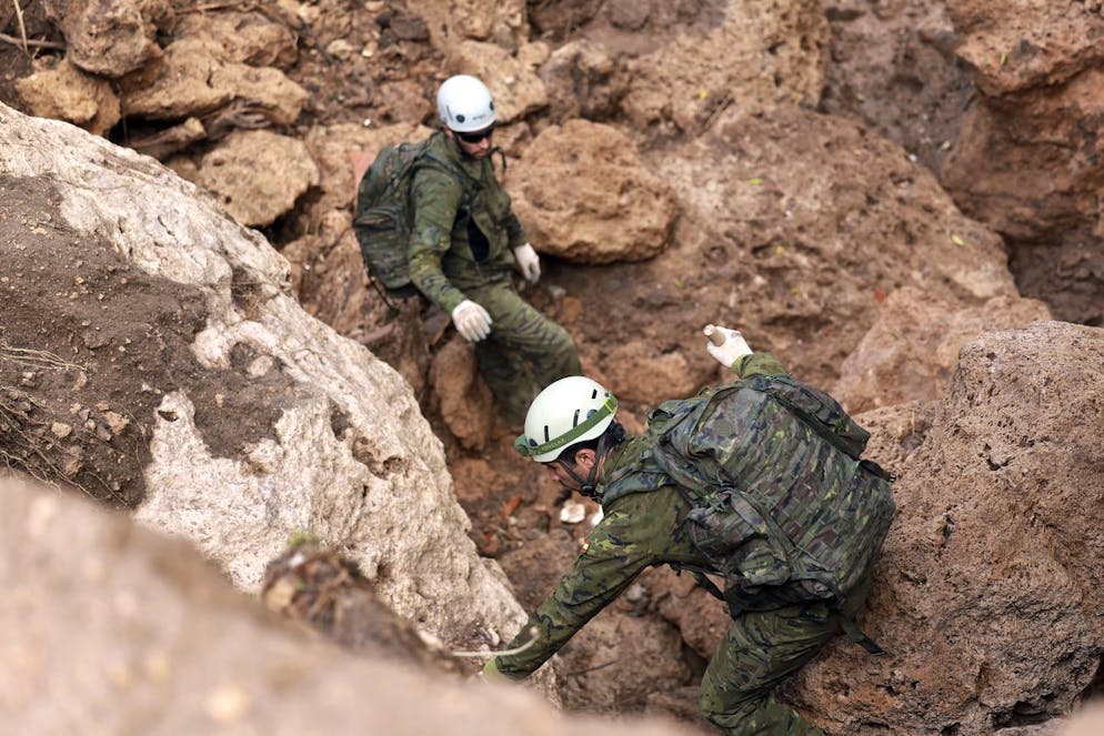 epa11695627 Members of the Spanish Military Emergency Unit (UME) search for victims in the flood-hit municipality of Letur, province of Albacete, Spain, 01 November 2024. Search and rescue operations continue in Letur, in Castile-La Mancha region, where several people remain missing. More than 150 people have died in the province of Valencia and neighboring provinces after floods caused by a DANA (high-altitude isolated depression) weather phenomenon hit the east of the country. According to Spain's national weather agency (AEMET), on 29 October 2024 Valencia received a year's worth of rain, causing flash floods that destroyed homes and swept away vehicles. EPA/ISMAEL HERRERO