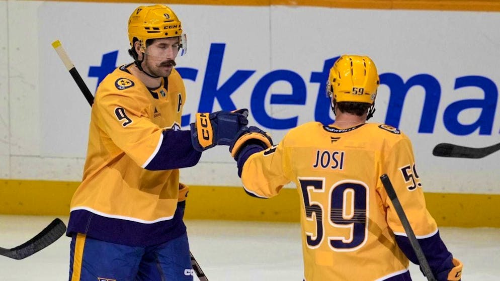 Roman Josi (59) is congratulated by Filip Forsberg after scoring his first goal of the season