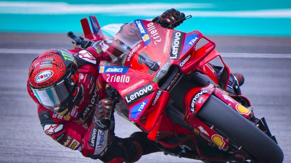 Ducati rider Francesco Bagnaia celebrates his tenth win of the season in Sepang