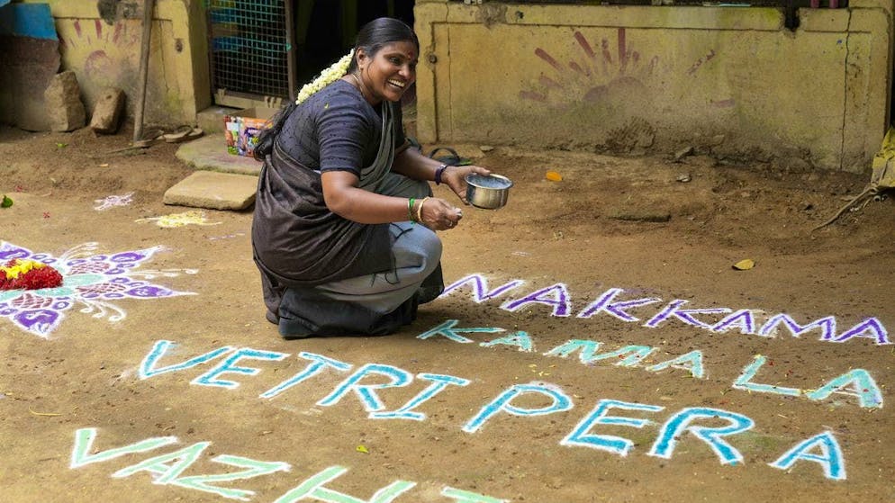Local politician Arulmozhi Sudhakar prepares a kolam - with best wishes for Kamala Harris.
