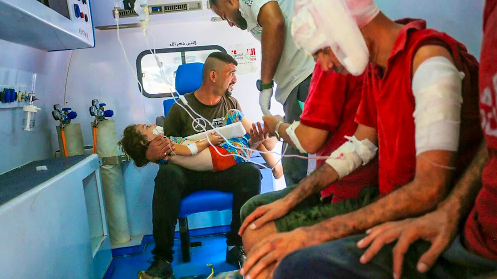 ARCHIVE - Injured Palestinians, including children, are taken to Al-Awda hospital for medical treatment after Israeli forces shelled a house belonging to the Shamiye family in Nuseirat refugee camp on August 27, 2024. Photo: Omar Ashtawy/APA Images via ZUMA Press Wire/dpa