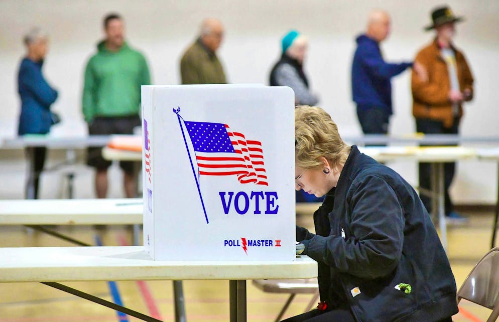 A woman marks her ballot on election day in Westmont Grove.