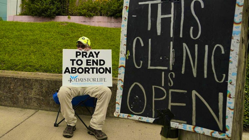 An anti-abortion activist has placed himself next to a health center in Jackson, Mississippi.