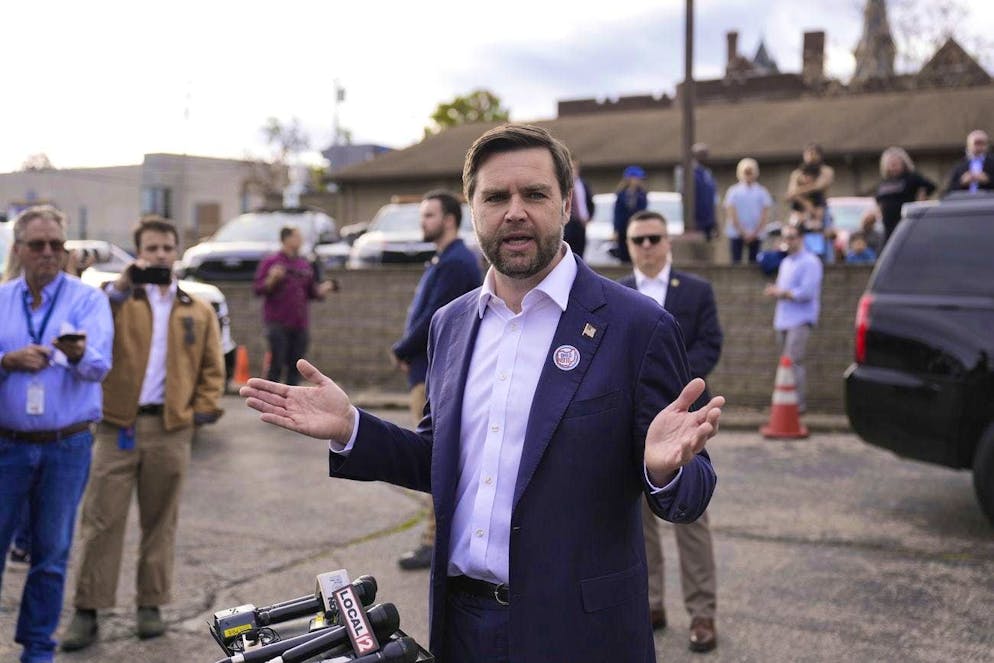 Vance speaks to reporters after casting his vote.