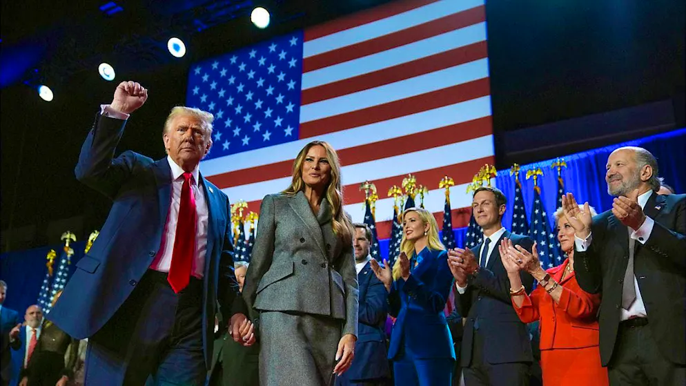Republican presidential candidate and former US presidential candidate Donald Trump (l-r) gestures next to former first lady Melania Trump at a US election party at the Palm Beach Convention Center. Photo: Evan Vucci/AP/dpa