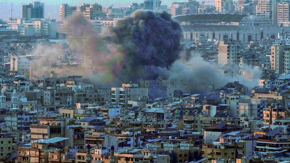 Smoke rises from the Dahieh neighborhood after an Israeli airstrike. Photo: Bilal Hussein/AP/dpa