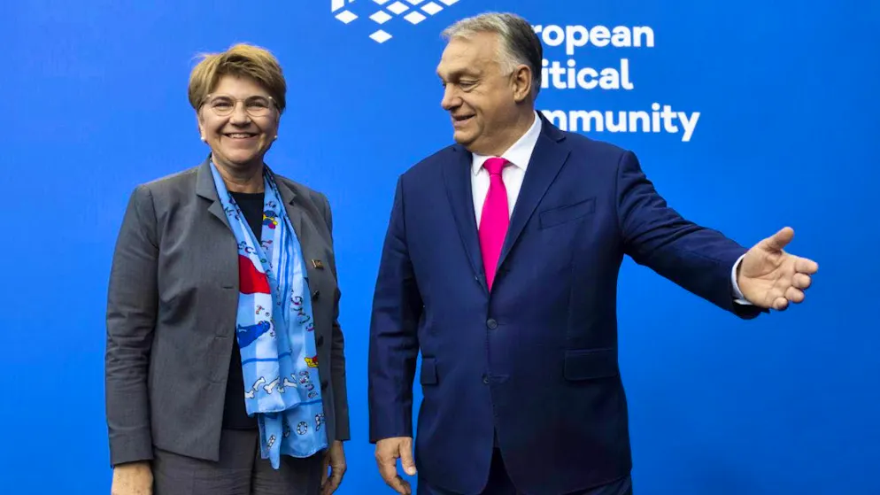 Viktor Orban, the Hungarian Prime Minister, greets Viola Amherd, President of the Swiss Confederation, on her arrival at the European Political Community meeting in Budapest.