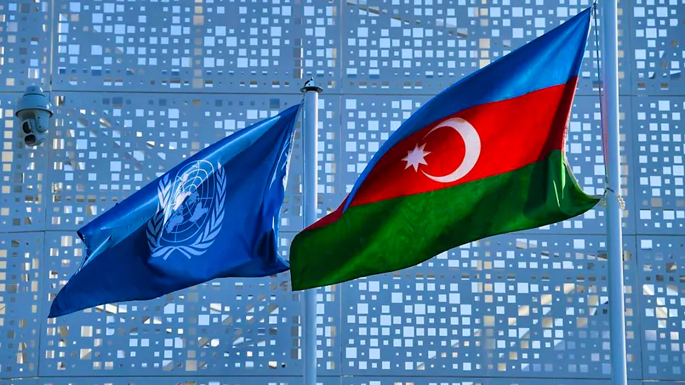 A flag of the United Nations and Azerbaijan is seen outside the venue of the UN Climate Change Conference COP29. Photo: Peter Dejong/AP/dpa