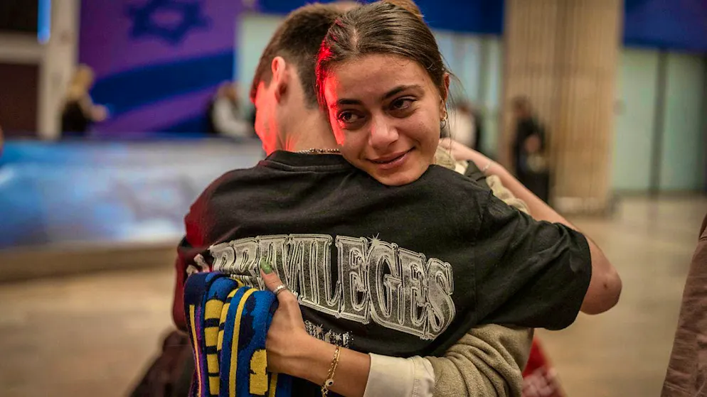 Israelis greet their relatives at Ben Gurion Airport after arriving on a plane from Amsterdam. Photo: Ilia Yefimovich/dpa