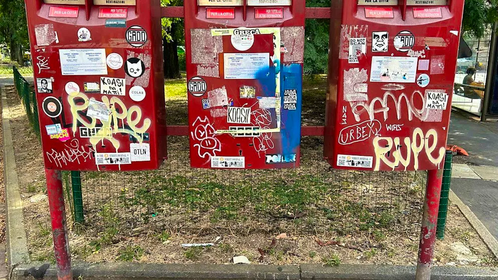 Italian post office letterboxes smeared and covered with stickers. Photo: Christoph Sator/dpa
