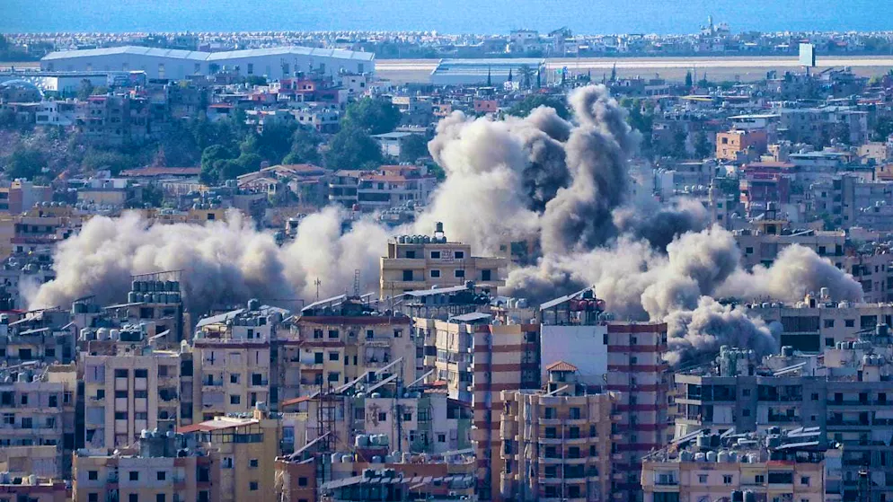 Smoke rises from the Dahieh district, Hezbollah's stronghold, after an Israeli airstrike. Photo: Hussein Malla/AP/dpa