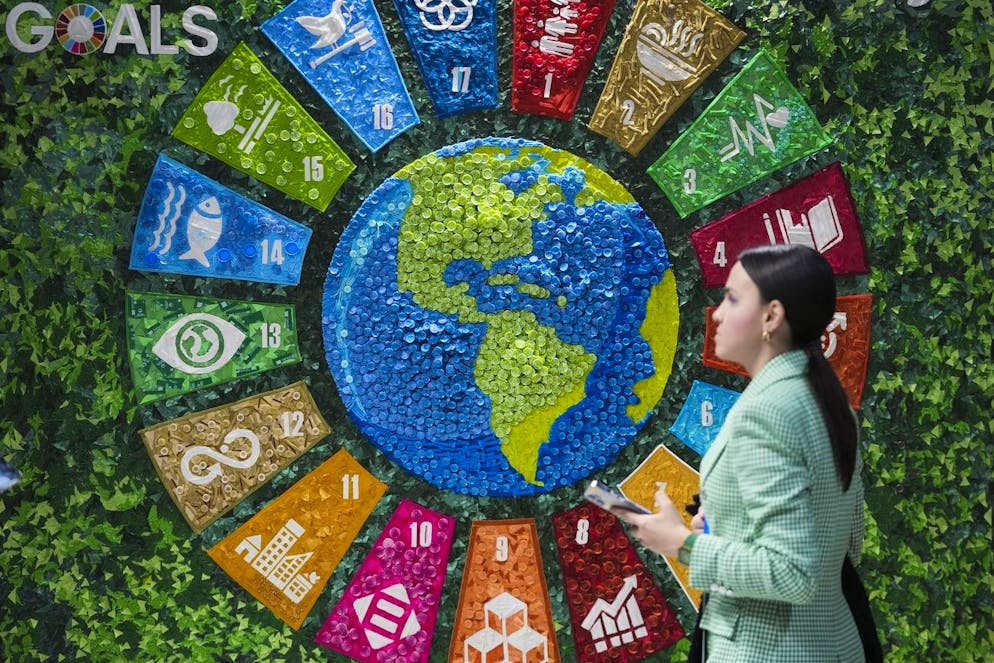 A person walks past art in the Turkey Pavilion at the COP29 U.N. Climate Summit, Thursday, Nov. 14, 2024, in Baku, Azerbaijan. (AP Photo/Sergei Grits)