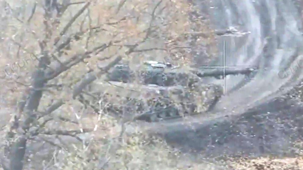 Situation picture Ukraine. Military convoy drives right in front of hidden Leopard tanks