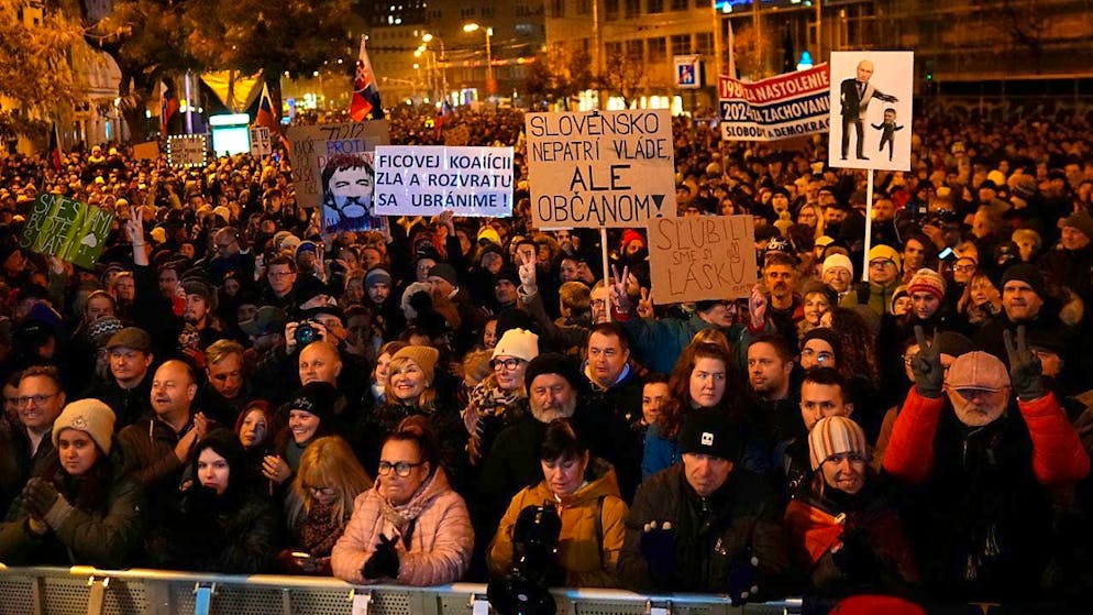 Demonstrators at a protest to mark the 35th anniversary of the Velvet Revolution and against the policies of populist Prime Minister Fico.