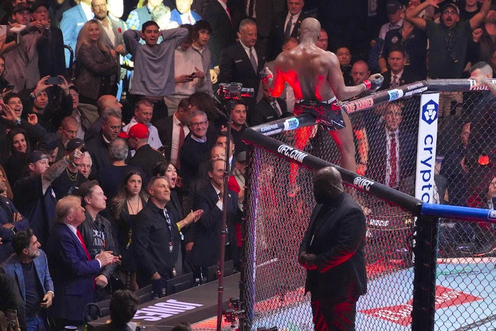 UFC fighter Jones knocks out Miocic and celebrates Donald Trump. Meanwhile, Jones is celebrated by the fans. Former and future US President Donald Trump and his bosom buddy Elon Musk are among those in the audience.