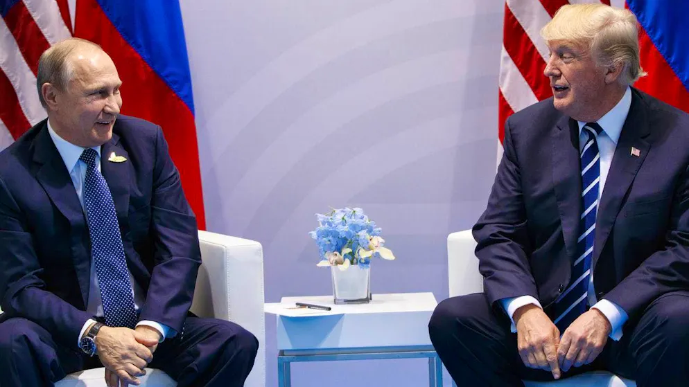 "Relatively short levers": Vladimir Putin (left) meets US President Donald Trump at the G20 summit in Hamburg in July 2017.