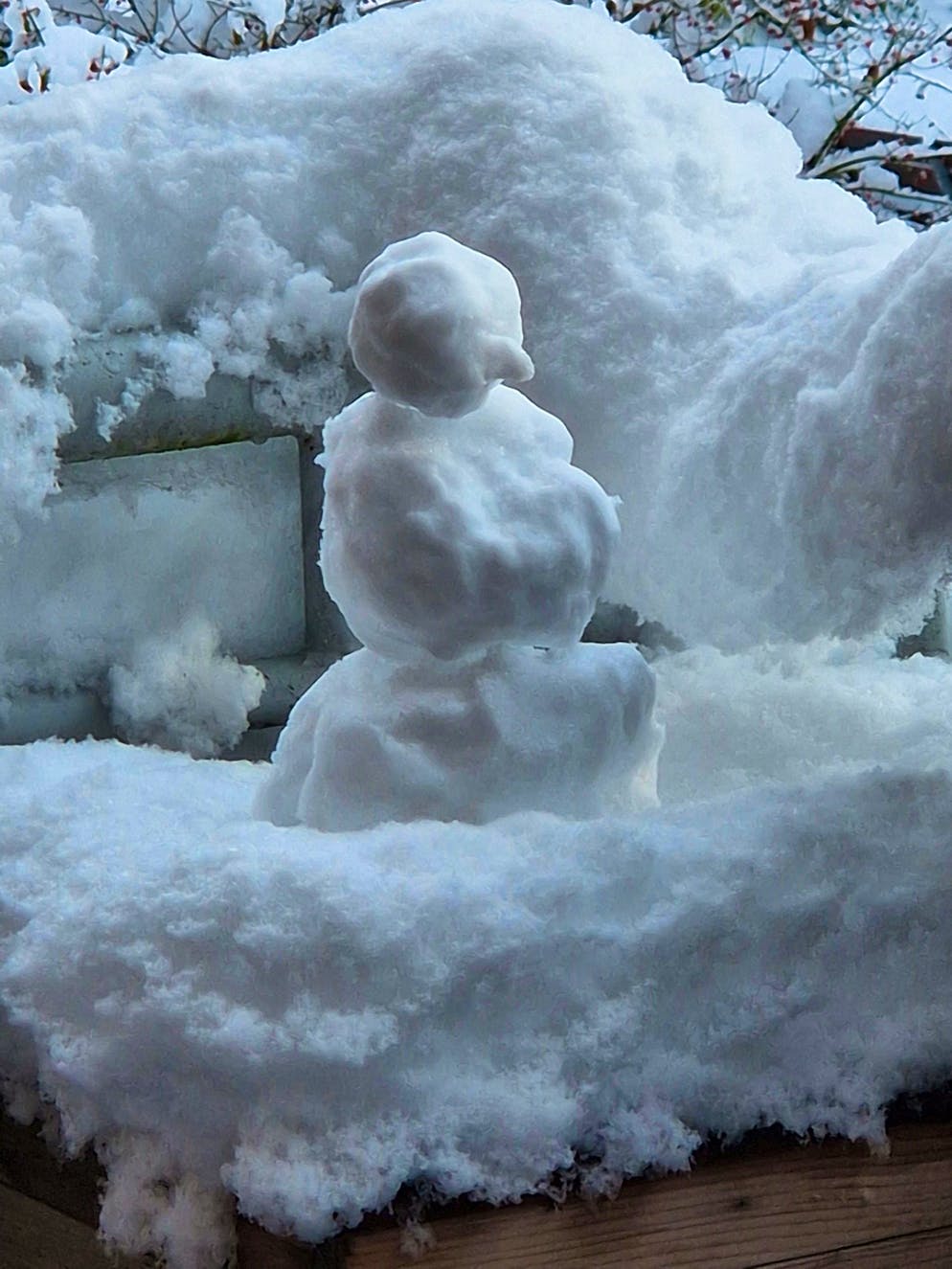 Winter onset Switzerland November 2024. The first little snowman stands on a balcony in Horw LU