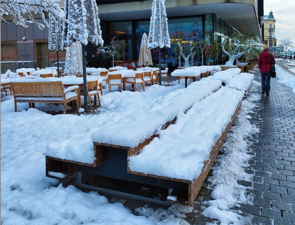 Winter onset Switzerland November 2024. Tables and benches are completely covered in snow in Kreuzlingen TG. 