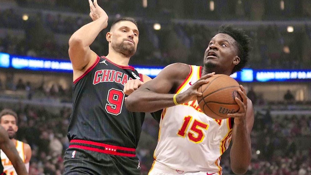 Clint Capela (right) is pressured by Nikola Vucevic of the Chicago Bulls