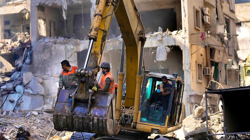 Rescue workers search for victims in Beirut. Photo: Hussein Malla/AP