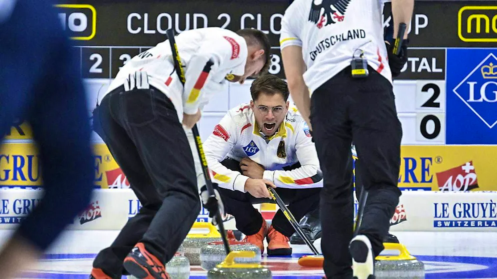 Marc Muskatewitz (center) led the German curlers to the European Championship triumph