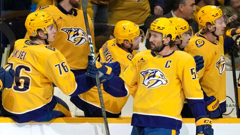 Roman Josi receives congratulations from his teammates