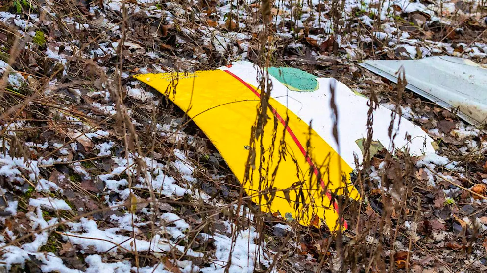 Debris from a DHL cargo plane that crashed into a house is seen near the Lithuanian capital Vilnius. Photo: Mindaugas Kulbis/AP