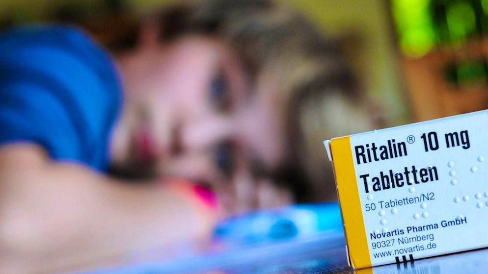 A packet of the drug Ritalin sits on a table where a ten-year-old boy is doing his homework. There has been a significant increase in the prescription of ADHD medication in Switzerland. (symbolic image)