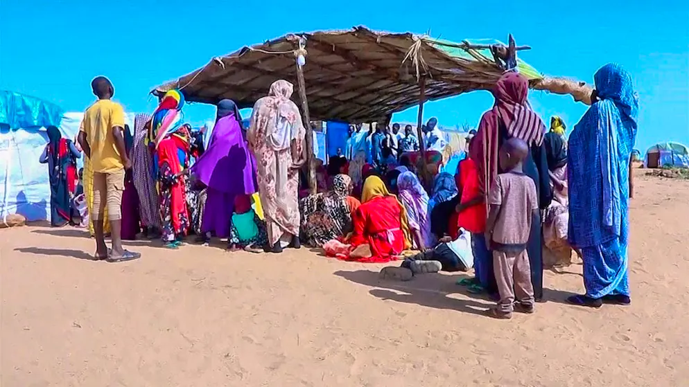 ARCHIVE - Sudanese refugees gather in front of a field hospital. Photo: Uncredited/AP/dpa