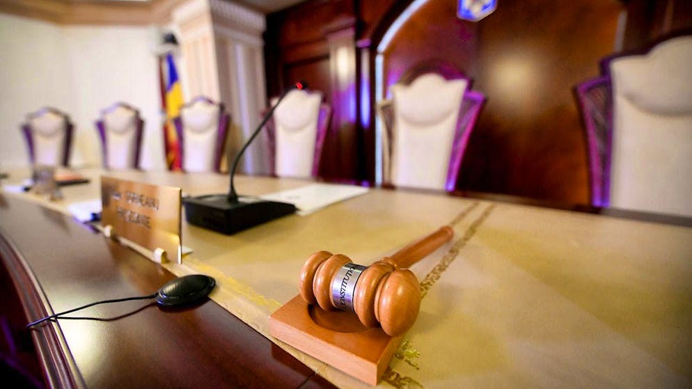 A gavel lies on the table of the judges in the Constitutional Court. Romania's Constitutional Court examines the legality of the presidential election. Photo: Andreea Alexandru/AP/dpa
