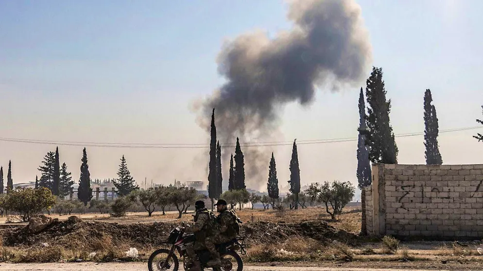 Plumes of smoke after an airstrike in Aleppo. Photo: Anas Alkharboutli/dpa