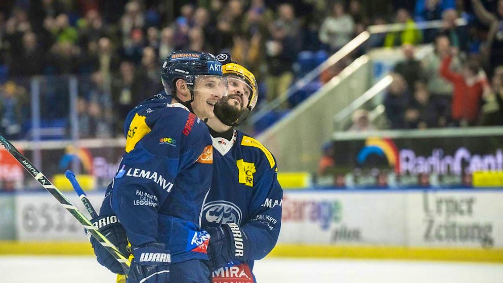 Ambri's Dominik Kubalik (left) celebrates after the 3-2 win