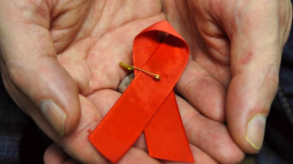 The red ribbon is the symbol of solidarity with HIV-positive and AIDS sufferers.