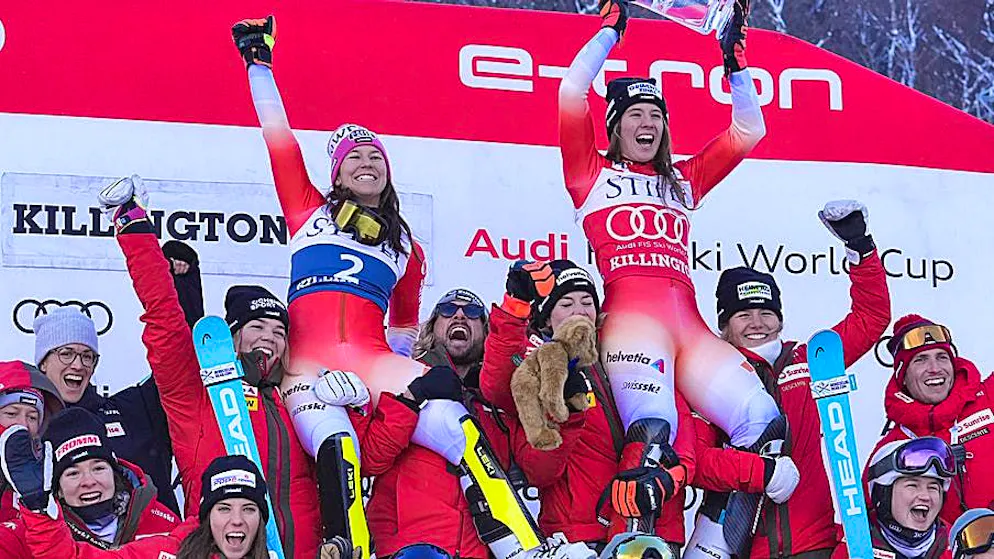 Camille Rast (right) and Wendy Holdener are celebrated by the Swiss team after their double victory in Killington.