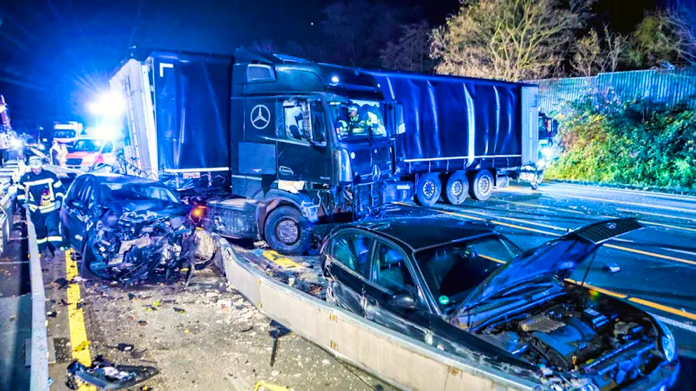 The truck on the Autobahn 1 near Hagen at the scene of the accident next to damaged cars. Photo: Alex Talash/dpa