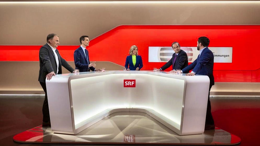 SVP President Marcel Dettling (from left), FDP President Thierry Burkart and Center President Gerhard Pfister, together with SP Co-President Cedric Wermuth, answer questions from SRF presenter Nathalie Christen on voting Sunday, November 24.