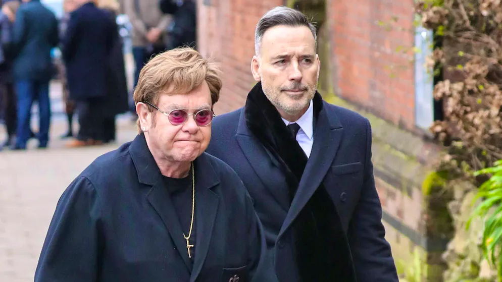 Elton John had to leave a musical performance in London early due to vision problems. The 77-year-old was led out of the auditorium by his husband David Furnish during the performance.