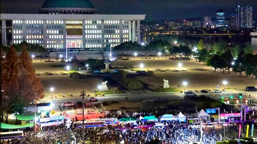 People gather in front of the National Assembly to demand the resignation of the South Korean president.