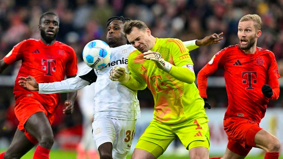 Manuel Neuer arrives too late and rams into Leverkusen's Jeremie Frimpong.
